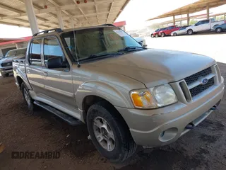 2004 Ford Explorer Sport Trac XLS z VIN 1FMDU77K14UA90758, wystawiony jako IAAI lot #42314709 z przebiegiem 149 559 mil mil oraz . Historia ofert i sprzedaży dostępna na DreamBid. Obrazek 1.