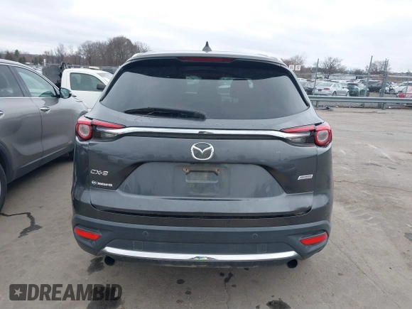 2016 Mazda CX-9 Grand Touring with VIN JM3TCADY4G0111310, listed as a IAAI auction lot 41532851 with 178,907 mi miles and . Bid and sale history available at DreamBid. Image 16.