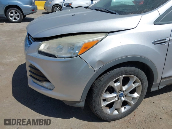 2013 Ford Escape SEL with VIN 1FMCU9HXXDUC17184, listed as a IAAI auction lot 42088020 with 63,151 mi miles. Bid and sale history available at carsss.com. Image 6.