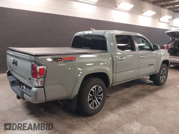 2023 Toyota Tacoma 4WD SR with VIN 3TMCZ5ANXPM607489, listed as a IAAI auction lot 41605018 with 15,229 mi miles. Bid and sale history available at carsss.com. Image 4.