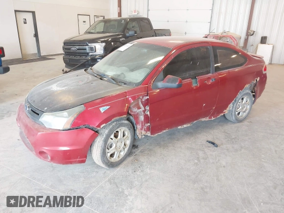 2009 Ford Focus SE with VIN 1FAHP32N49W222419, listed as a IAAI auction lot 42113655 with 238,936 mi miles. Bid and sale history available at carsss.com. Image 2.