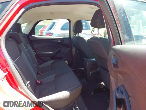 2012 Ford Focus SE z VIN 1FAHP3F23CL333598, wystawiony jako IAAI lot #41970172 z przebiegiem 209 969 mil mil oraz . Historia ofert i sprzedaży dostępna na DreamBid. Obrazek 8.