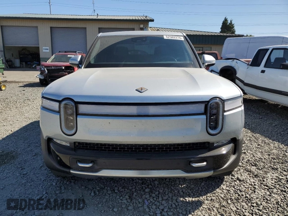 2023 Rivian R1T Adventure z VIN 7FCTGBAA0PN025046, wystawiony jako Copart lot #62502274 z przebiegiem 1385 mil mil oraz Szkody całkowita. Historia ofert i sprzedaży dostępna na DreamBid. Obrazek 5.