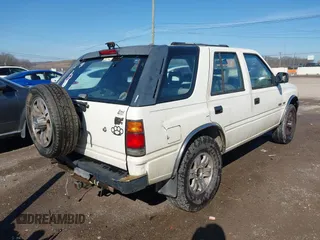 1997 Isuzu Rodeo z VIN 4S2CK58V2V4300048, wystawiony jako IAAI lot #41446738 z przebiegiem 195 609 mil mil oraz . Historia ofert i sprzedaży dostępna na DreamBid. Obrazek 4.
