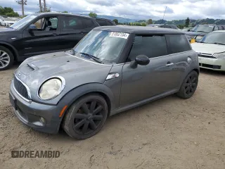 2009 MINI Hardtop S with VIN WMWMF73529TX40593, listed as a Copart auction lot 51852154 with 115,858 mi miles and Salvage Title. Bid and sale history available at DreamBid. Image 1.