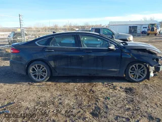 2020 Ford Fusion Hybrid Titanium with VIN 3FA6P0RU9LR141476, listed as a IAAI auction lot 41472921 with 84,433 mi miles. Bid and sale history available at carsss.com. Image 14.