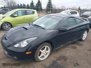 2000 Toyota Celica GT with VIN JTDDR32T7Y0006809, listed as a IAAI auction lot 41860933 with 262,014 mi miles. Bid and sale history available at carsss.com. Image 2.