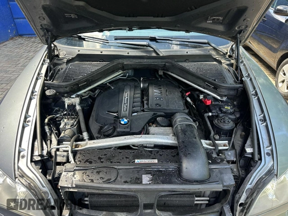 2012 BMW X5 35i with VIN 5UXZV4C55CL986439, listed as a Copart auction lot 63034725 with 188,238 mi miles and Clean title. Bid and sale history available at DreamBid. Image 7.