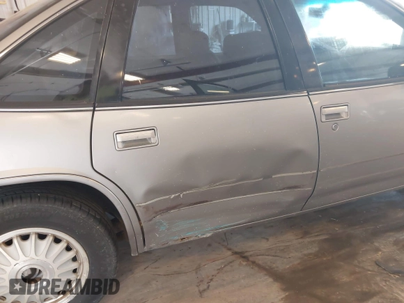 1996 Buick Regal Custom z VIN 2G4WB52M2T1462761, wystawiony jako IAAI lot #42483788 z przebiegiem 156 925 mil mil oraz . Historia ofert i sprzedaży dostępna na DreamBid. Obrazek 6.