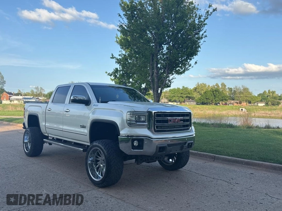 2015 GMC Sierra 1500 SLT with VIN 3GTU2VEC0FG239547, listed as a Copart auction lot 54957305 with 135,497 mi miles and Clean Title. Bid and sale history available at DreamBid. Image 1.