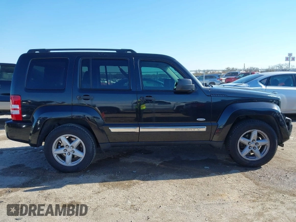 2012 Jeep Liberty Sport z VIN 1C4PJLAK6CW188649, wystawiony jako IAAI lot #41042923 z przebiegiem 174 598 mil mil oraz . Historia ofert i sprzedaży dostępna na DreamBid. Obrazek 13.