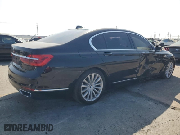 2017 BMW 7 Series 740i with VIN WBA7E2C50HG739565, listed as a Copart auction lot 64584885 with 114,496 mi miles and Salvage title. Bid and sale history available at DreamBid. Image 3.