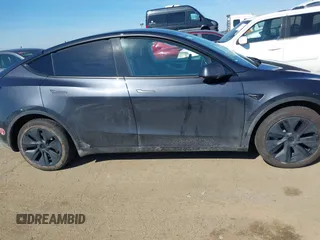 2024 Tesla Model Y with VIN 7SAYGDED8RF213796, listed as a IAAI auction lot 41634130 with 7,710 mi miles and . Bid and sale history available at DreamBid. Image 12.