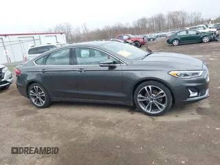 2019 Ford Fusion Titanium with VIN 3FA6P0K9XKR259556, listed as a IAAI auction lot 41823997 with 132,071 mi miles. Bid and sale history available at carsss.com. Image 13.