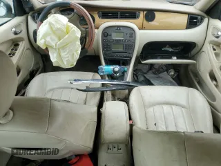 2003 Jaguar X-Type z VIN SAJEB52D33XD54978, wystawiony jako Copart lot #58027805 z przebiegiem Nie podano mil oraz Szkoda całkowita • Salvage title. Historia ofert i sprzedaży dostępna na DreamBid. Obrazek 8.