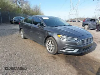 2017 Ford Fusion Energi SE with VIN 3FA6P0PUXHR352762, listed as a IAAI auction lot 41940937 with 74,402 mi miles. Bid and sale history available at carsss.com. Image 1.