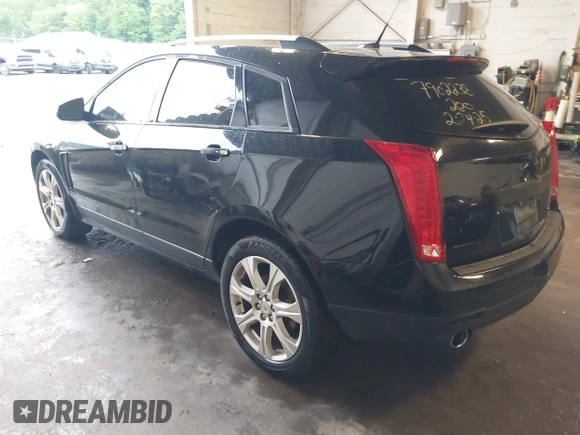 2014 Cadillac SRX Performance Collection with VIN 3GYFNFE39ES659013, listed as a IAAI auction lot 42264069 with 129,122 mi miles and . Bid and sale history available at DreamBid. Image 3.