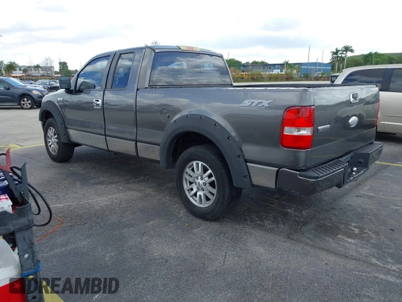 2007 Ford F-150 STX with VIN 1FTRX14W97FB49702, listed as a IAAI auction lot 41566306 with 236,003 mi miles. Bid and sale history available at carsss.com. Image 3.