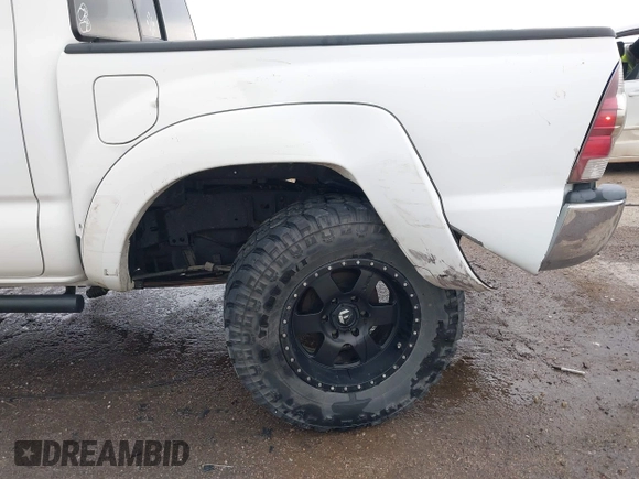 2014 Toyota Tacoma with VIN 3TMLU4EN8EM139665, listed as a IAAI auction lot 41925143 with 190,690 mi miles and . Bid and sale history available at DreamBid. Image 6.