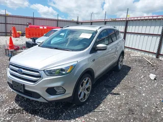 2017 Ford Escape Titanium with VIN 1FMCU0J99HUB23567, listed as a IAAI auction lot 42127795 with 93,056 mi miles. Bid and sale history available at carsss.com. Image 2.