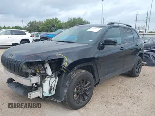 2023 Jeep Cherokee Altitude Lux with VIN 1C4PJMMB9PD114936, listed as a IAAI auction lot 42159214 with 59,525 mi miles. Bid and sale history available at carsss.com. Image 2.