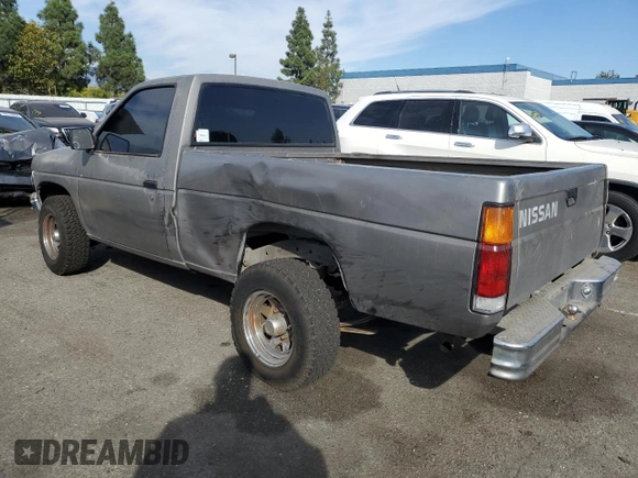 1987 Nissan Hardbody E z VIN JN6ND11SXHW014073, wystawiony jako Copart lot #78956934 z przebiegiem 381 885 mil mil oraz Szkody całkowita. Historia ofert i sprzedaży dostępna na DreamBid. Obrazek 2.