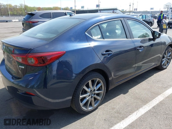 2018 Mazda 3 Grand Touring with VIN 3MZBN1W36JM213063, listed as a IAAI auction lot 42102460 with 49,180 mi miles and . Bid and sale history available at DreamBid. Image 4.