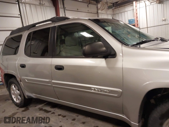 2005 GMC Envoy SLE with VIN 1GKET16S656102522, listed as a IAAI auction lot 41729310 with 233,049 mi miles. Bid and sale history available at carsss.com. Image 14.