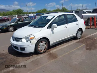 2009 Nissan Versa 1.8 S with VIN 3N1BC11E99L371998, listed as a IAAI auction lot 41723771 with 130,172 mi miles. Bid and sale history available at carsss.com. Image 2.