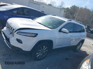 2015 Jeep Cherokee Limited with VIN 1C4PJLDB9FW677367, listed as a IAAI auction lot 41826477 with 125,648 mi miles and . Bid and sale history available at DreamBid. Image 14.