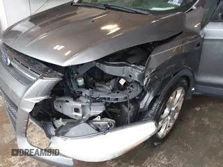 2013 Ford Escape SE z VIN 1FMCU9G91DUA98069, wystawiony jako IAAI lot #42278684 z przebiegiem 187 770 mil mil oraz . Historia ofert i sprzedaży dostępna na DreamBid. Obrazek 6.