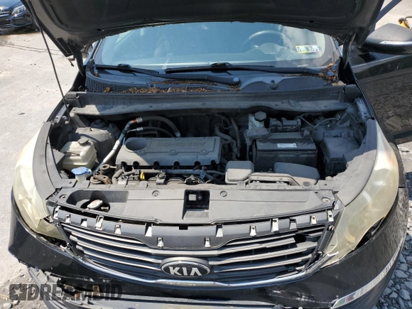 2013 Kia Sportage LX z VIN KNDPBCA27D7489178, wystawiony jako Copart lot #59559795 z przebiegiem 183 659 mil mil oraz Szkoda całkowita • Salvage title. Historia ofert i sprzedaży dostępna na DreamBid. Obrazek 12.