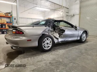 2001 Chevrolet Camaro Z28 z VIN 2G1FP22GX12112874, wystawiony jako Copart lot #70669594 z przebiegiem 58 773 mil mil oraz Szkoda całkowita • Salvage title. Historia ofert i sprzedaży dostępna na DreamBid. Obrazek 3.