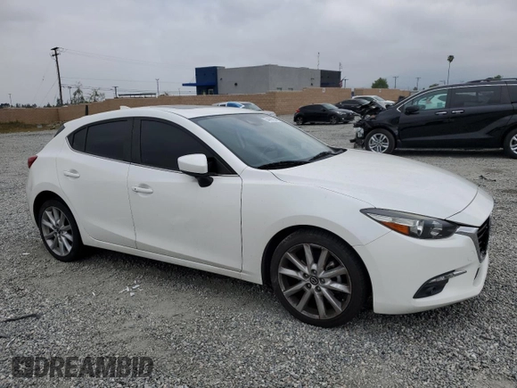 2017 Mazda 3 Grand Touring with VIN JM1BN1M35H1122136, listed as a Copart auction lot 54458755 with 62,515 mi miles and Salvage Title. Bid and sale history available at DreamBid. Image 4.