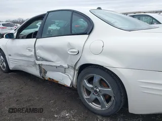 2004 Pontiac Bonneville SLE z VIN 1G2HY52K54U215710, wystawiony jako IAAI lot #41497635 z przebiegiem 123 343 mil mil oraz . Historia ofert i sprzedaży dostępna na DreamBid. Obrazek 12.