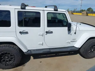 2017 Jeep Wrangler Unlimited Sahara with VIN 1C4BJWEG5HL588535, listed as a IAAI auction lot 42013571 with 70,012 mi miles. Bid and sale history available at carsss.com. Image 14.