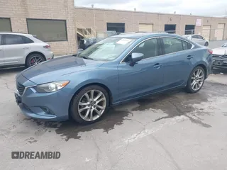 2014 Mazda 6 i Grand Touring with VIN JM1GJ1W64E1133729, listed as a IAAI auction lot 42050222 with 112,464 mi miles and . Bid and sale history available at DreamBid. Image 2.