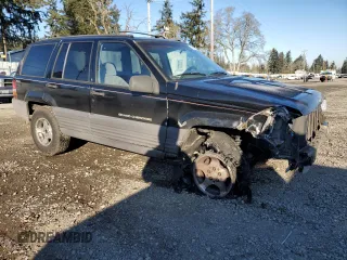 1998 Jeep Grand Cherokee Laredo with VIN 1J4GZ58S0WC106148, listed as a Copart auction lot 42855105 with 263,785 mi miles and Salvage Title. Bid and sale history available at carsss.com. Image 4.