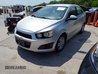 2014 Chevrolet Sonic LT with VIN 1G1JC5SH0E4210327, listed as a IAAI auction lot 42069313 with 94,506 mi miles and . Bid and sale history available at DreamBid. Image 2.