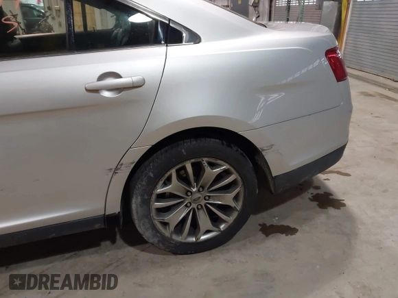2013 Ford Taurus Limited with VIN 1FAHP2F83DG116657, listed as a IAAI auction lot 41533075 with 124,649 mi miles. Bid and sale history available at carsss.com. Image 20.