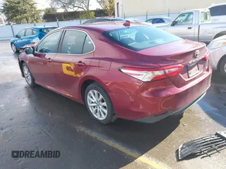 2020 Toyota Camry LE with VIN 4T1C11AK4LU916494, listed as a IAAI auction lot 41786429 with 100,032 mi miles and . Bid and sale history available at DreamBid. Image 3.