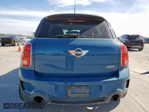 2012 MINI Countryman S with VIN WMWZC3C5XCWM27675, listed as a Copart auction lot 49676205 with 111,499 mi miles and Salvage title. Bid and sale history available at DreamBid. Image 6.