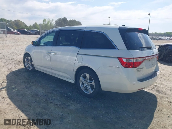2013 Honda Odyssey Touring with VIN 5FNRL5H96DB009694, listed as a IAAI auction lot 42002487 with 182,867 mi miles and . Bid and sale history available at carsss.com. Image 3.