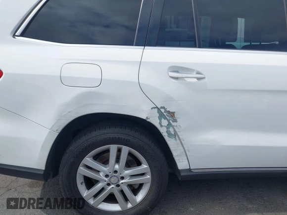 2014 Mercedes-Benz GL 450 z VIN 4JGDF7CE0EA424081, wystawiony jako IAAI lot #42359465 z przebiegiem 145 363 mil mil oraz . Historia ofert i sprzedaży dostępna na DreamBid. Obrazek 18.
