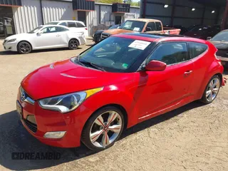 2012 Hyundai Veloster w/Gray Int z VIN KMHTC6AD0CU048339, wystawiony jako IAAI lot #42040008 z przebiegiem 117 895 mil mil oraz . Historia ofert i sprzedaży dostępna na DreamBid. Obrazek 2.