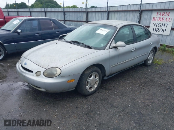 1997 Ford Taurus GL z VIN 1FALP52UXVG180596, wystawiony jako IAAI lot #42463461 z przebiegiem 190 419 mil mil oraz . Historia ofert i sprzedaży dostępna na DreamBid. Obrazek 2.