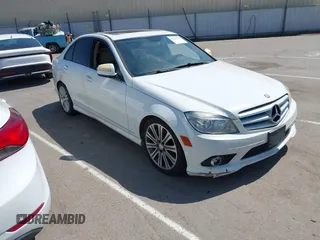 2009 Mercedes-Benz C-Class 3.0L Sport with VIN WDDGF54X09F233877, listed as a IAAI auction lot 42121123 with 215,698 mi miles. Bid and sale history available at carsss.com. Image 1.