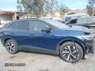 2023 Volkswagen ID.4 Pro z VIN 1V2DNPE8XPC019169, wystawiony jako IAAI lot #41313501 z przebiegiem 32 552 mil mil oraz . Historia ofert i sprzedaży dostępna na DreamBid. Obrazek 14.