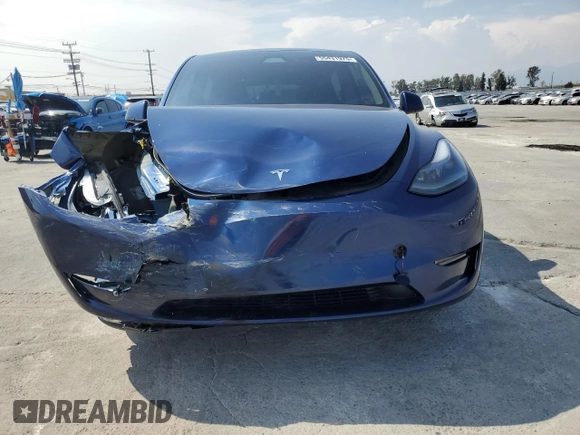 2024 Tesla Model Y with VIN 7SAYGDED0RF102479, listed as a Copart auction lot 55431975 with 23,989 mi miles and Salvage title. Bid and sale history available at DreamBid. Image 5.
