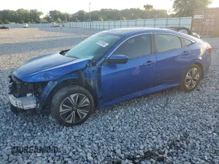 2018 Honda Civic EX-T z VIN JHMFC1F32JX014434, wystawiony jako Copart lot #51815955 z przebiegiem 143 385 mil mil oraz Szkoda całkowita • Salvage title. Historia ofert i sprzedaży dostępna na DreamBid. Obrazek 1.